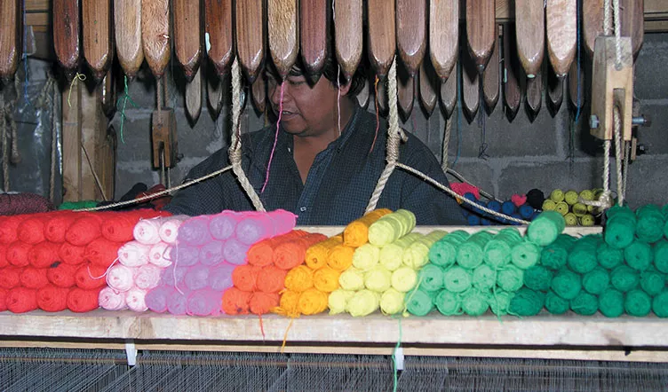 Saltillo Blanket - Weaver using traditional hand loom
